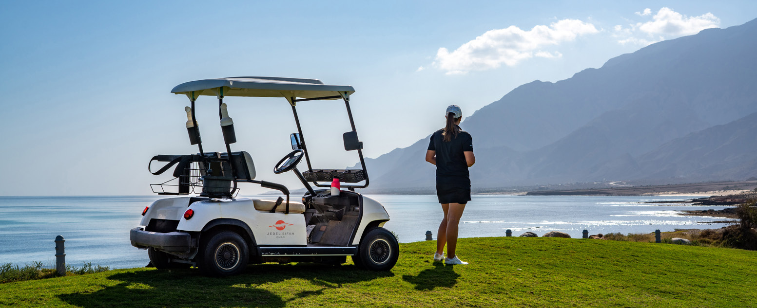 Golf course beside the coastline in Jebel Sifah, Oman